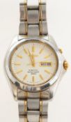 Seiko Kinetic, a stainless-steel gentleman's wristwatch the cream dial with day/date aperture,