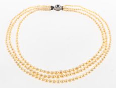 A three strand pearl necklace, three strands of graduated cultured pearls, sizes range from approx.