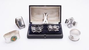 A mixed group of silver ball sports napkin rings including;