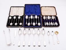 A mixed group of silver spoons including; a cased set of six golfing tea spoons,