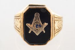 An onyx Masonic ring, the onyx with attached Masonic symbol, carved shoulders, marked 10K,