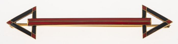 An enamel arrow brooch, of Art Deco geometric style with red and black enamelling,