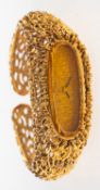 A 9ct gold bracelet watch of tree bark form the oval dial with black baton numeral and bevelled