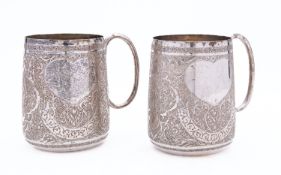 A pair of early 20th century Iranian silver mugs, three marks to base, inverted tapering form,
