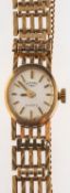 Rotary, a 9ct gold lady's wristwatch the oval silvered dial signed Rotary,