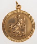 A 9ct gold St Christopher pendant, of circular form, UK hallmark, diameter approx. 1.9cm, 2.4grams.