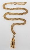 A 9ct gold golfer pendant with chain, an articulated golfer pendant set with cultured pearl,