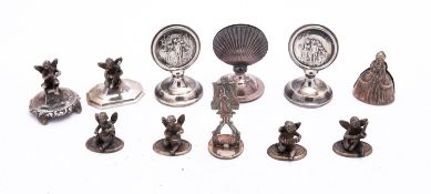 A mixed group of silver menu holders including;