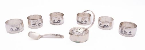 A set of six mid 20th century Iraqi niello decorated silver napkin rings, not marked,
