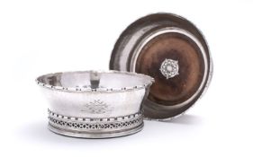 A pair of Omar Ramsden silver wine coasters, London 1933, engraved Omar Ramsden Me Fecit,