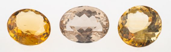 A group of three loose semi-precious gemstones to include: A loose circular-cut citrine, approx. 12.