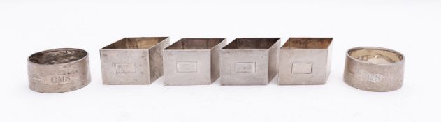 A set of four Art Deco silver napkin rings by Henry Bushell & Co, Birmingham 1936,