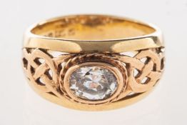 A 9ct Welsh gold Celtic ring, set to the centre with an oval-cut paste stone, UK hallmark,