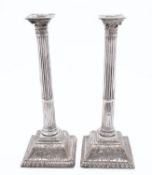 A pair of late 18th century Sheffield Plate Corinthian column candlesticks, not marked,