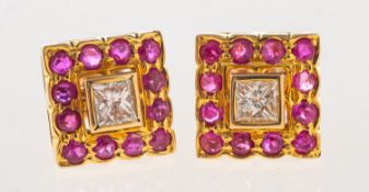 A pair of ruby and diamond earrings,