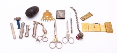 A mixed group of sewing related items including;