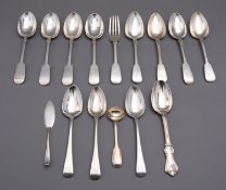 A mixed group of silver flatware including; a matched set of eight Fiddle pattern dessert spoons,