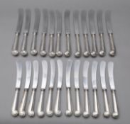A set of twelve Elizabeth II silver Pistol-grip handled table knives by C W Fletcher & Son Ltd,