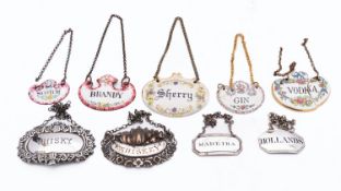 A group of wine labels including; a George III silver Hollands label by Elizabeth Morley,