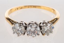 A diamond trilogy ring, claw set with three brilliant-cut diamonds, diamonds approx. 0.