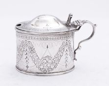 A Victorian silver mustard pot by Richard Martin & Ebenezer Hall, London 1884, of oval form,