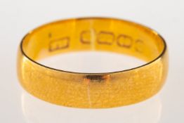 An 22ct gold wedding band, UK hallmark, size N, 3.4grams.