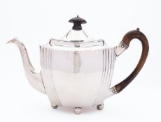 A George III silver teapot by William, Peter and Anne Bateman, London 1801, of oval form,