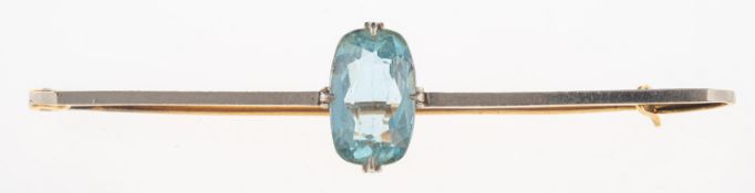 A 1920's aquamarine brooch, a bi-metal bar brooch set with an oval mixed-cut aquamarine,