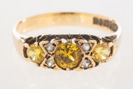 A 9ct gold ring, set with yellow and white paste stones, UK hallmark, size N1/2, 2.1grams.