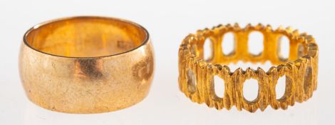 An 18ct gold textured ring and a 9ct gold wedding band,