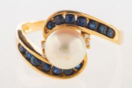 A pearl, sapphire and diamond ring, a crossover designed ring set with a cultured pearl,