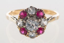 A cluster ring, set with circular-cut white and red paste stones, marked PLAT, 9ct, size M, 2.
