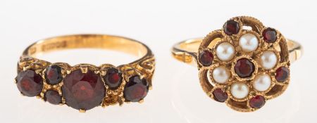 Two 9ct gold garnet set rings,