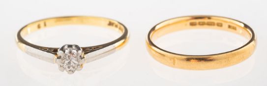 A diamond solitaire ring and a wedding band,