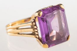 A dress ring, claw set with a rectangular-cut synthetic alexandrite, unmarked, size L, 5.8grams.
