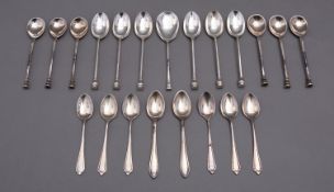 A mixed group of silver teaspoons including; two sets of six seal top spoons,