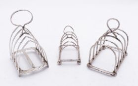 A mixed group of silver including; a five bar toast rack by James Dixon & Sons Ltd, Sheffield 1922,