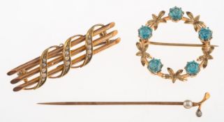 Two brooches and a stick pin,