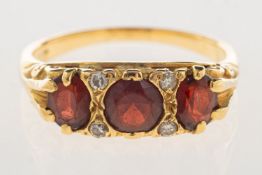 An antique garnet and diamond ring,