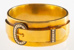 A Victorian buckle bangle, a hinged bangle,