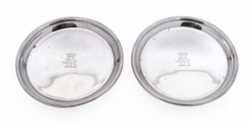 A pair of George V silver decanter coasters by D & J Wellby Ltd, London 1928, of circular form,