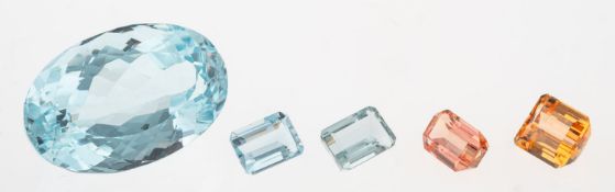 A group of five loose semi-precious gemstones to include: A loose oval-cut blue topaz, approx. 36.