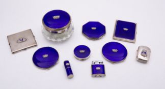 A group of silver and enamel Royal Naval compacts including; four compacts,