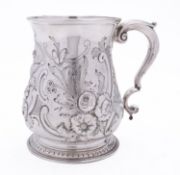 A George II silver mug by Henry Brind, London 1749, of baluster form, leaf capped S scrolled handle,