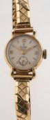 Tudor a 9ct gold lady's wristwatch the round cream dial signed Tudor Royal along with the Tudor