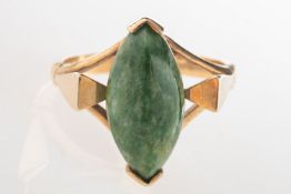 A marquise shaped ring, set with a marquise-cut green mottled hardstone cabochon,