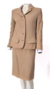 Jaeger, London, a lady's cream wool twin set, comprising half length jacket and skirt,