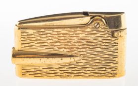 A vintage Ronson lighter, gold plated with engine turned design, signed, measuring approx. 5.
