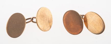 A pair of cufflinks, of oval form with chain link fitting, marked 9ct, 10.4grams.