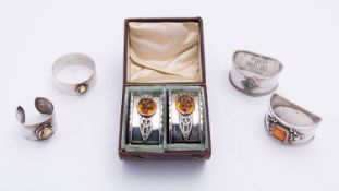 A cased pair of Arts and Crafts silver napkin rings by H.M.